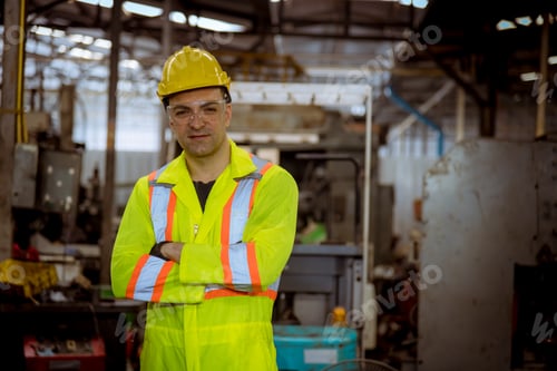 Preview: The Industry worker wearing safety uniform, glass and ear phone control operating lathe grinding mac