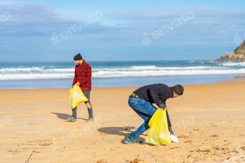 Preview: Volunteers collecting plastic on the beach. Ecology concept, sea pollution