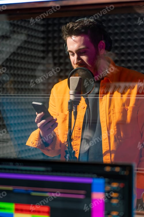 Preview: artist recording a new song in recording studio sound engineer watching tracks on display