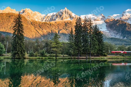 Preview: Lac des Gaillands with train passing and Mont Blanc massif reflection in the sunset