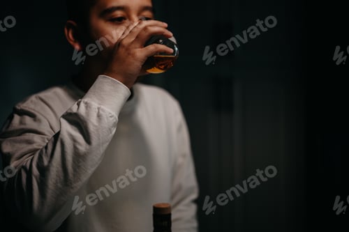 Preview: Man sipping drinking wine liquor whiskey bourbon whisky rye glass holding cup up mouth moody tasting