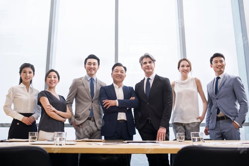 Preview: Confident business people in meeting room