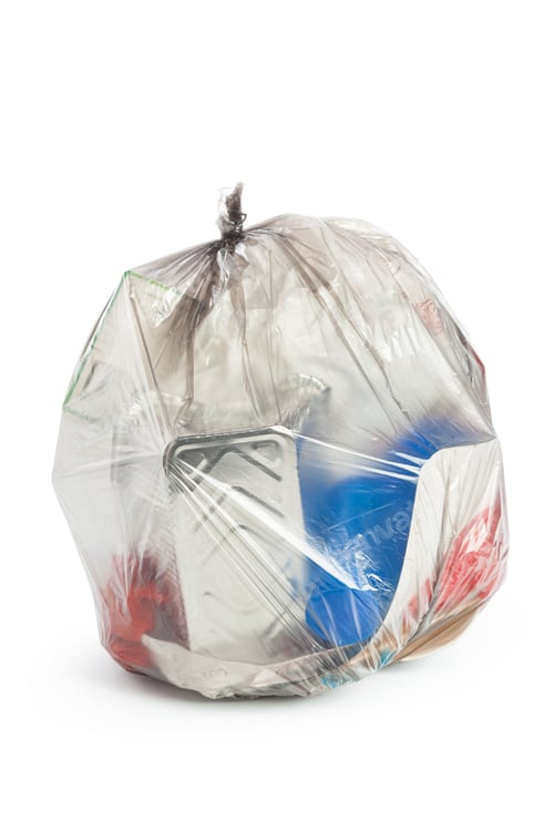 Preview: Container filled with trash is tied up in a plastic bag ready for disposal in a kitchen