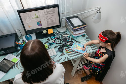Preview: Woman teleworking with her daughter drawing