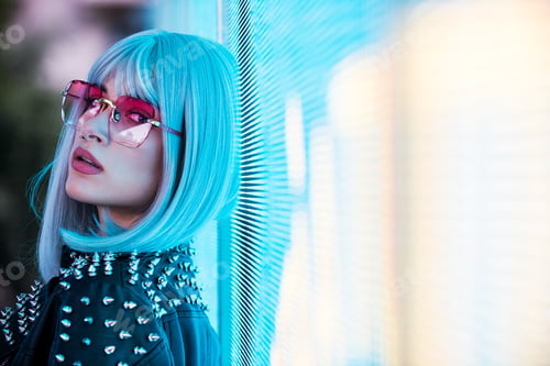 Preview: Beautiful woman illuminated by led lights