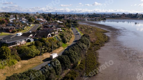 Preview: Aerial view of a residential area in Pilot Bay against a cloudy sky