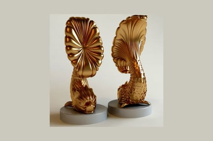 Gold fish-shaped bookends with ornate fins