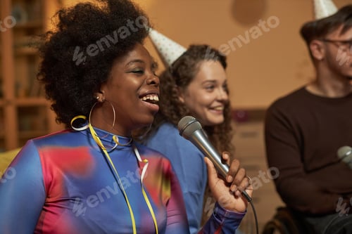 Preview: Black Woman Singing to Microphone and Enjoying Karaoke with Friends