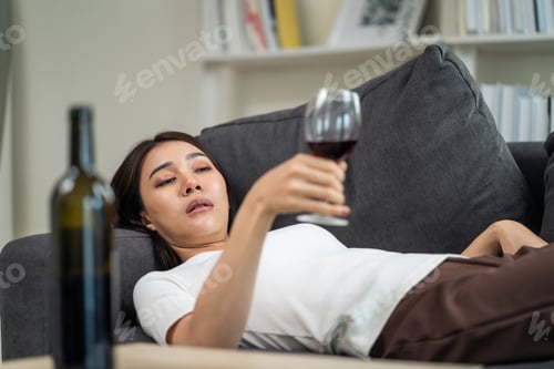 Preview: Asian young depression woman feeling heart broken and drinking alcohol.