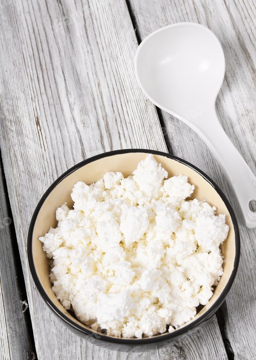Preview: Cottage cheese on wooden board .