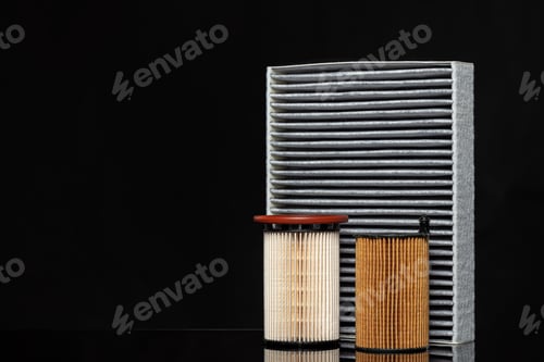 Preview: Car engine filter on dark background, close up