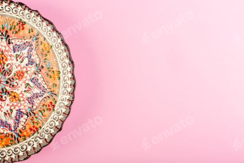 Preview: a top view designed empty plate painted glass made plate for meal on the pink background dish