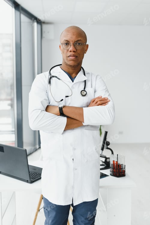 Preview: young male african doctor in hospital.