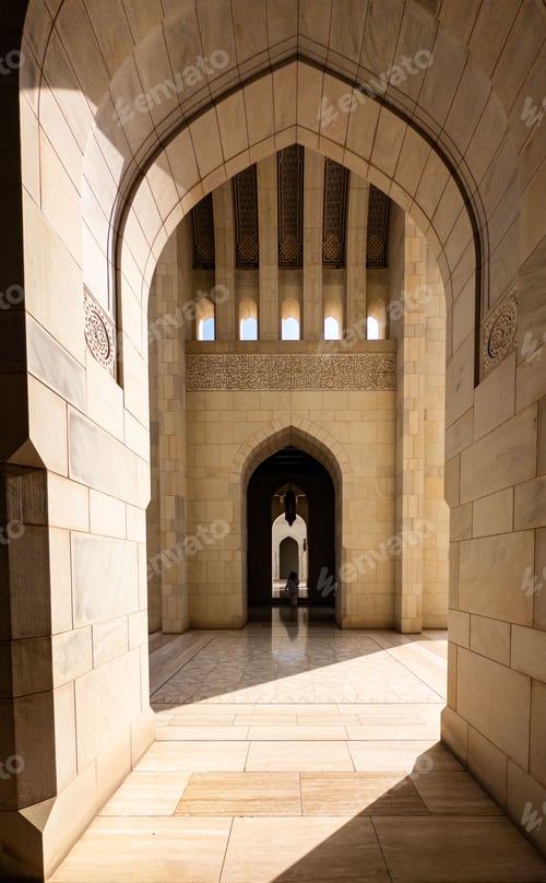 Preview: A stunning view of a grand mosque through a series of arches.