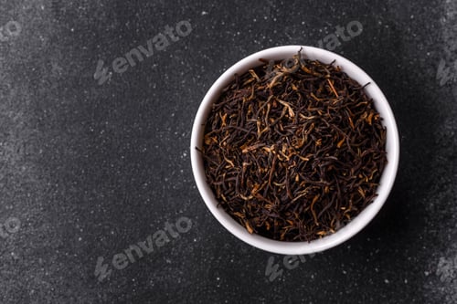 Preview: Golden black tea, dried leaves of a Chinese or Indian breakfast drink. Black tea dried leaves