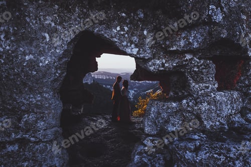 Preview: Wedding photo shoot at mountain Mangup in Crimea. Silhouette of loving couple newlyweds
