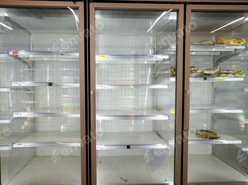 Preview: almost empty freezer at the supermarket during corona virus covid 19 lockdown