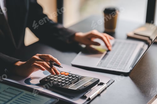 Preview: Portrait of a woman working on a tablet computer in a modern office. Make an account analysis report