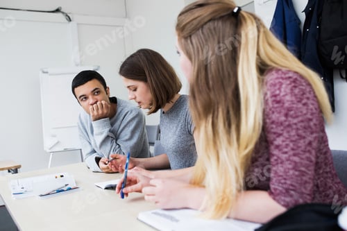 Preview: Students (16-17) sitting at desk in classroom