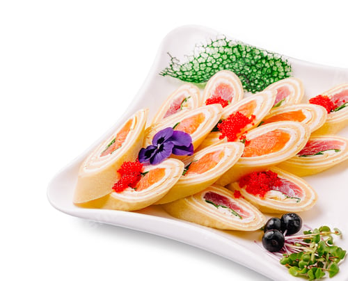Preview: Colorful sushi rolls served on elegant platter with garnishes