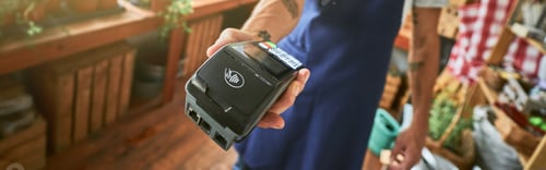 Preview: Selective focus on bank terminal in man hand