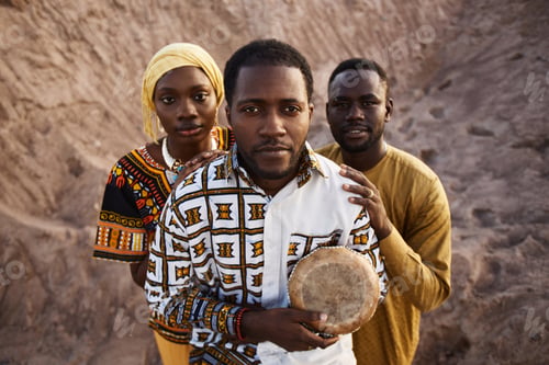 Preview: Group of African American People in Traditional Clothing Standing in Sand