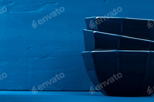 Preview: Dark blue crockery on blue wooden background