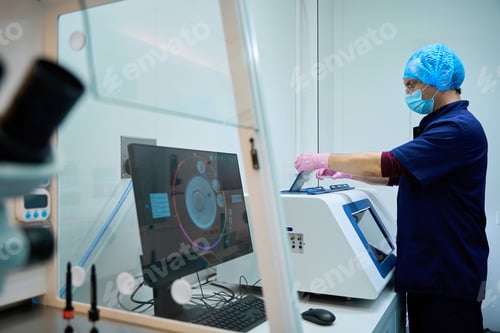 Preview: Lab technician monitors data on cryopreservation display