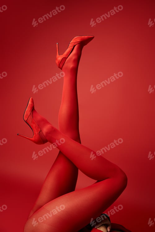 Preview: Crimson elegance: woman in red stockings and high heels