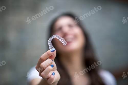 Preview: Beautiful Smiling Turkish Woman with invisible teeth bracket aligner
