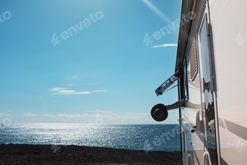 Preview: Tourism and summer holiday vacation people excited with arm and hat outside the camper