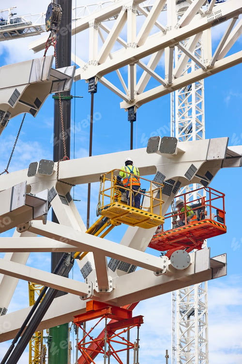 Preview: Workers on a construction site. Engineering and architectural infrastructure. Safety