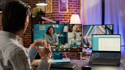 Preview: Male freelancer using online videoconference call to chat with people