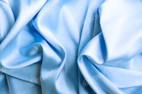 Preview: Blue silk satin abstract background. Beautiful soft wavy folds on smooth luxury shiny fabric