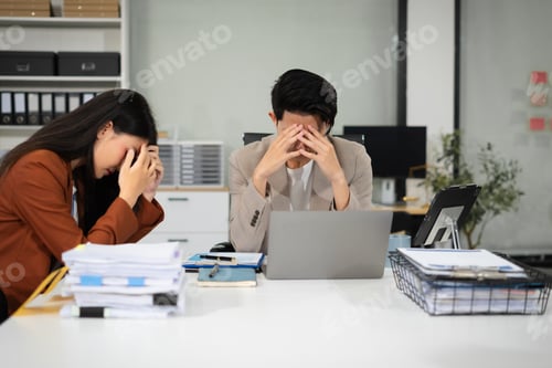 Vista previa: Businessman team working are under stress from financial data and report graph.