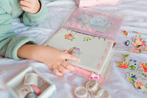 Preview: Kid making handmade scrapbook