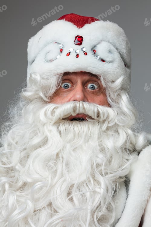 Preview: portrait of surprised santa claus with big eyes in his suit