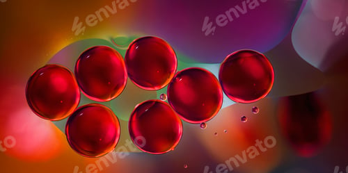 Preview: macro of red oil drops on water surface