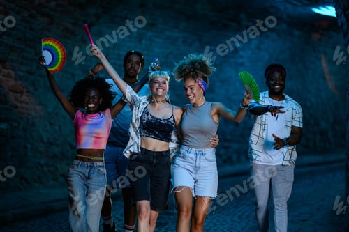 Preview: Friends walking and celebrating at summer music festival