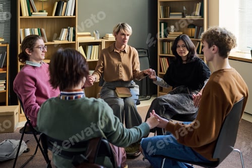 Preview: Diverse Young People Sitting in Circle Participating in Group Therapy Session