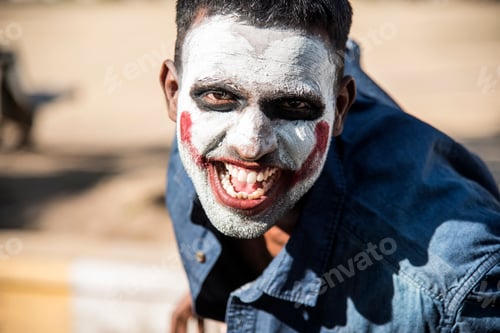 Preview: Close-up portrait of a horrible scary zombie man. Horror. Halloween.