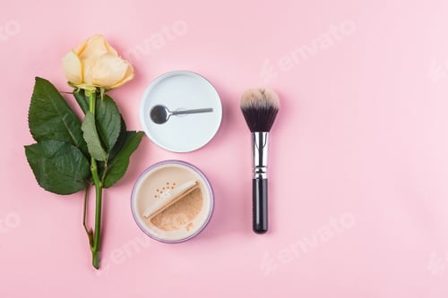 Preview: Set of cosmetics powder and brushe with rose on pink background. Makeup Accessories Top view Flat