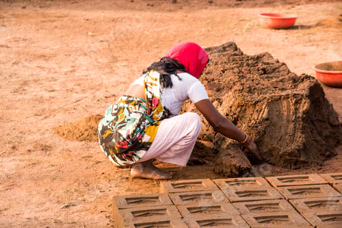 Preview: Indian worker making house bricks