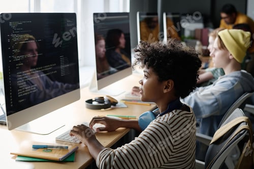 Preview: Black Boy Coding on Computer in Class