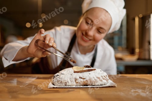 Preview: Bread bakery worker decorating diet wheat loaf or bun