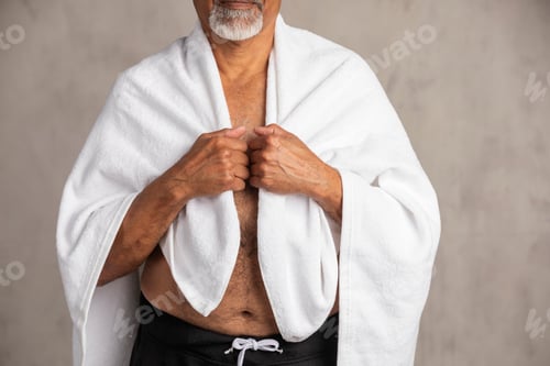 Preview: Senior African American man with a white bath towel