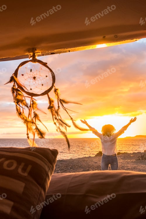 Preview: Travel and freedom concept with standing happy joy woman outside vehicle van