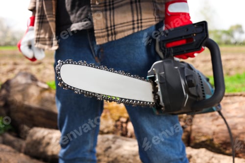 Preview: Man with modern saw on sunny day, closeup