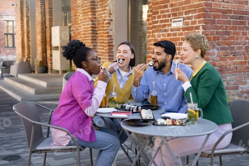 Preview: Friends Enjoying Sushi Outdoors