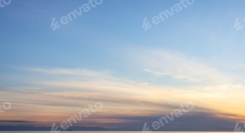 Preview: View of colorful cloudscape during vibrant summer sunset on the ocean coast